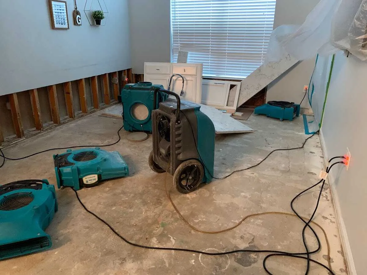 Dehumidifier in flood-cut room for Water Damage Restoration in Bruce